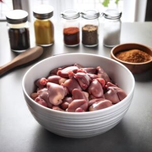 Cleaned chicken gizzards displayed in a bowl, showing their firm texture