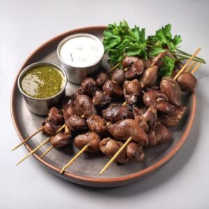 Grilled chicken hearts on skewers and fried chicken gizzards served with dipping sauces