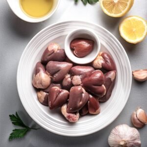 A plate of cleaned chicken hearts ready for marinating