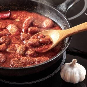 Loose beef chorizo being stirred in a skillet