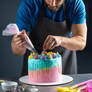 Piping colorful frosting swirls onto a Unicorn Cake