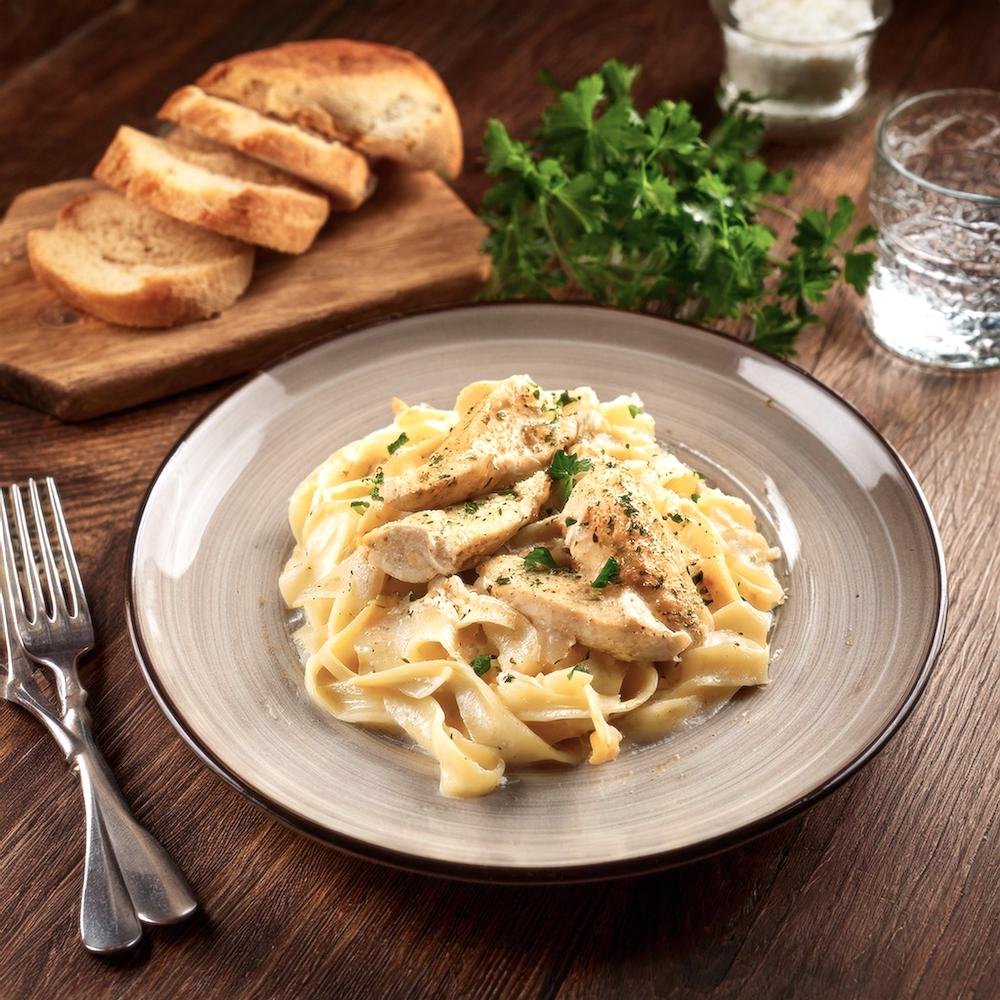 A plate of garlic parmesan chicken pasta