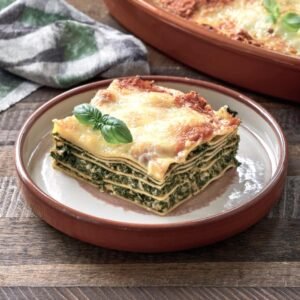 Baked lasagna al forno topped with béchamel and ragù