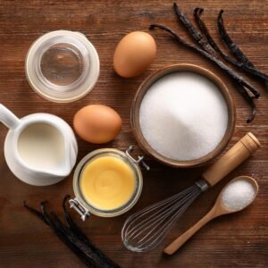 Ingredients for crème brûlée on a kitchen countertop