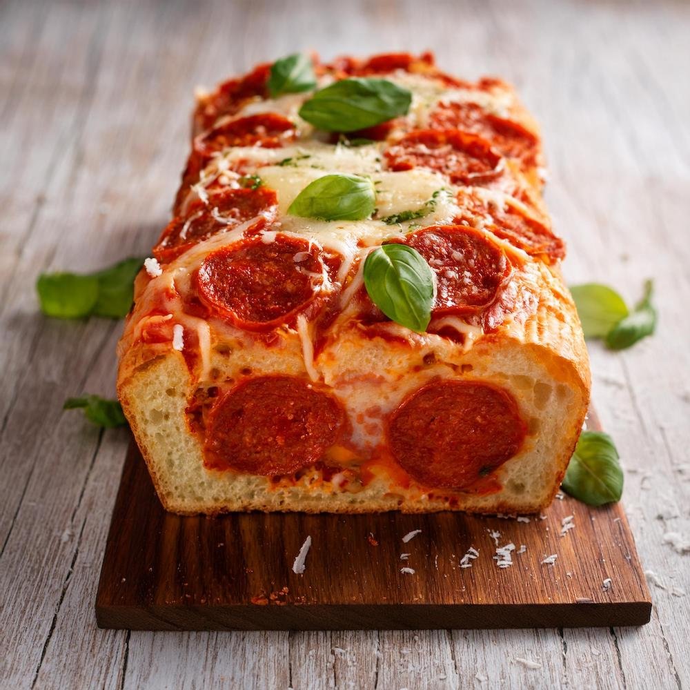 An Italian-style garbage bread with pepperoni, mozzarella, and marinara filling.