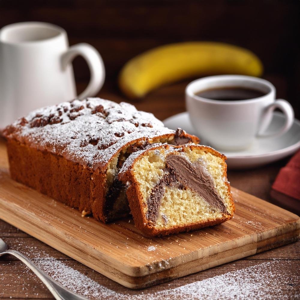 A dessert garbage bread filled with Nutella and bananas, dusted with powdered sugar.