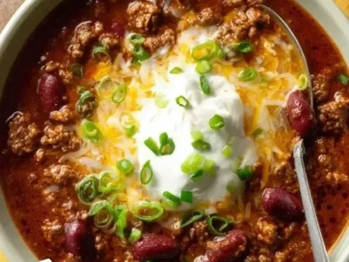 Bowl of award-winning championship chili recipe topped with fresh cilantro