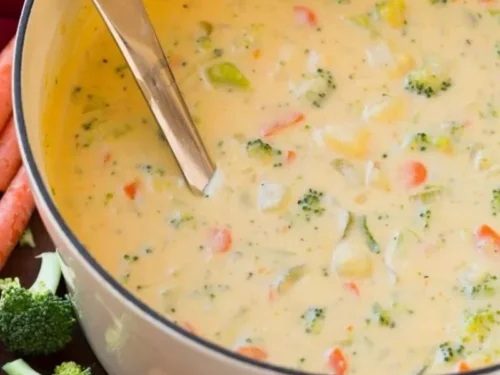 A bowl of creamy Cheddar Broccoli Potato Soup with broccoli and potatoes