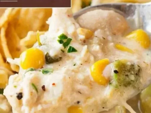 Bowl of creamy Crockpot White Chicken Chili topped with cilantro and cheese