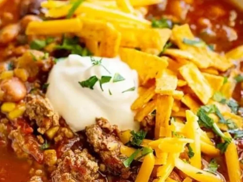 Delicious bowl of Taco Soup topped with cheese and cilantro