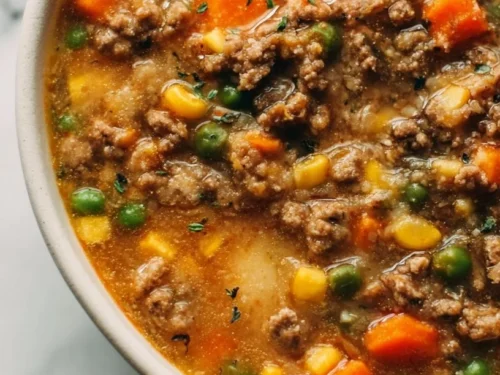 Bowl of cozy Shepherd's Pie Soup with ground beef and mixed vegetables.