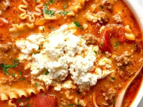 Bowl of easy 30-minute lasagna soup garnished with fresh herbs