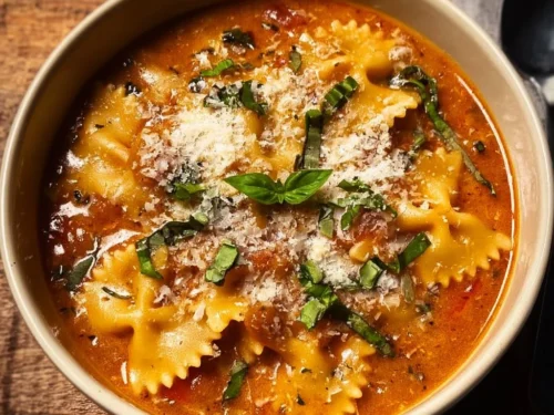 Bowl of creamy lasagna soup with cheese and herbs, perfect for fall meals