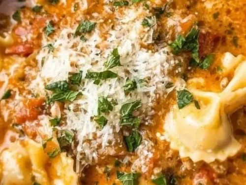 Bowl of easy creamy lasagna soup with cheese and herbs, perfect for quick dinners.