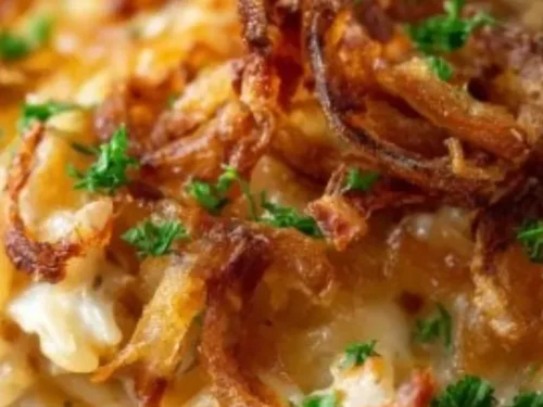 French onion chicken orzo casserole dish garnished with herbs
