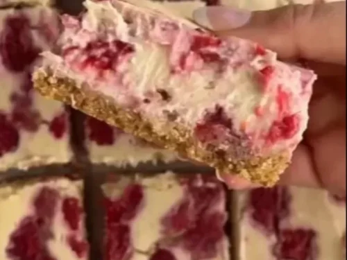 Healthy high protein raspberry cheesecake bars with fresh raspberries