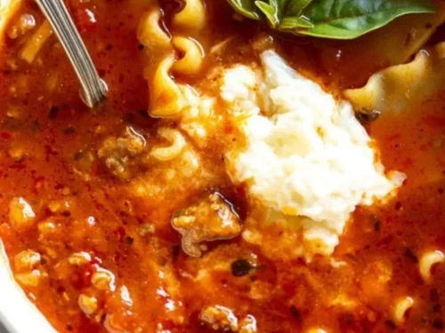 Delicious bowl of homemade lasagna soup topped with cheese and herbs