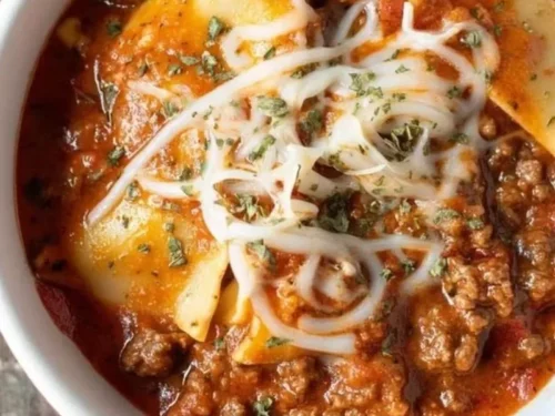 Bowl of quick and easy lasagna soup topped with cheese and herbs