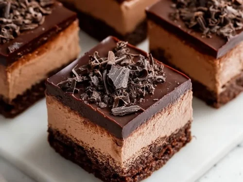Layered chocolate mousse brownies dessert with rich chocolate flavor