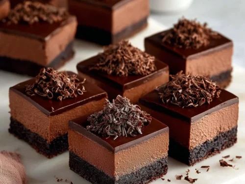 Decadent chocolate mousse brownies with a rich, creamy texture and chocolate topping.