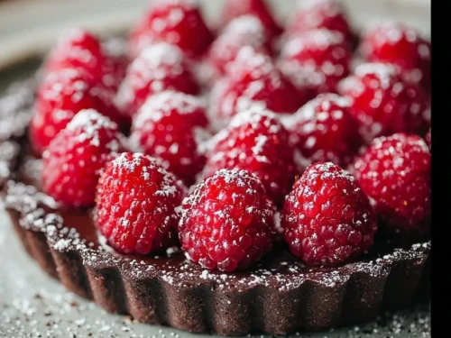 Decadent chocolate raspberry tart dessert perfect for Valentine's Day celebration