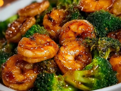 Plate of high-protein honey garlic shrimp served with vegetables