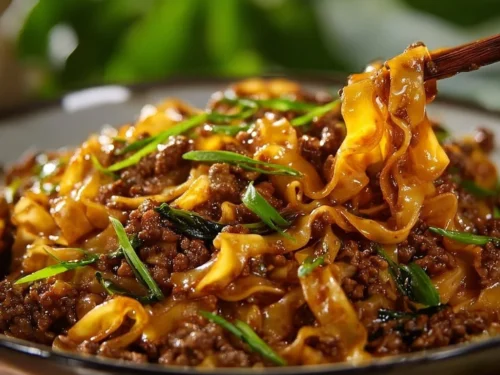 Delicious potsticker noodle bowl topped with vegetables and savory broth