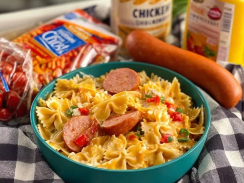 Creamy Cajun sausage pasta in a skillet garnished with parsley