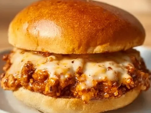 Cajun Chicken Sloppy Joes served on a plate with colorful toppings